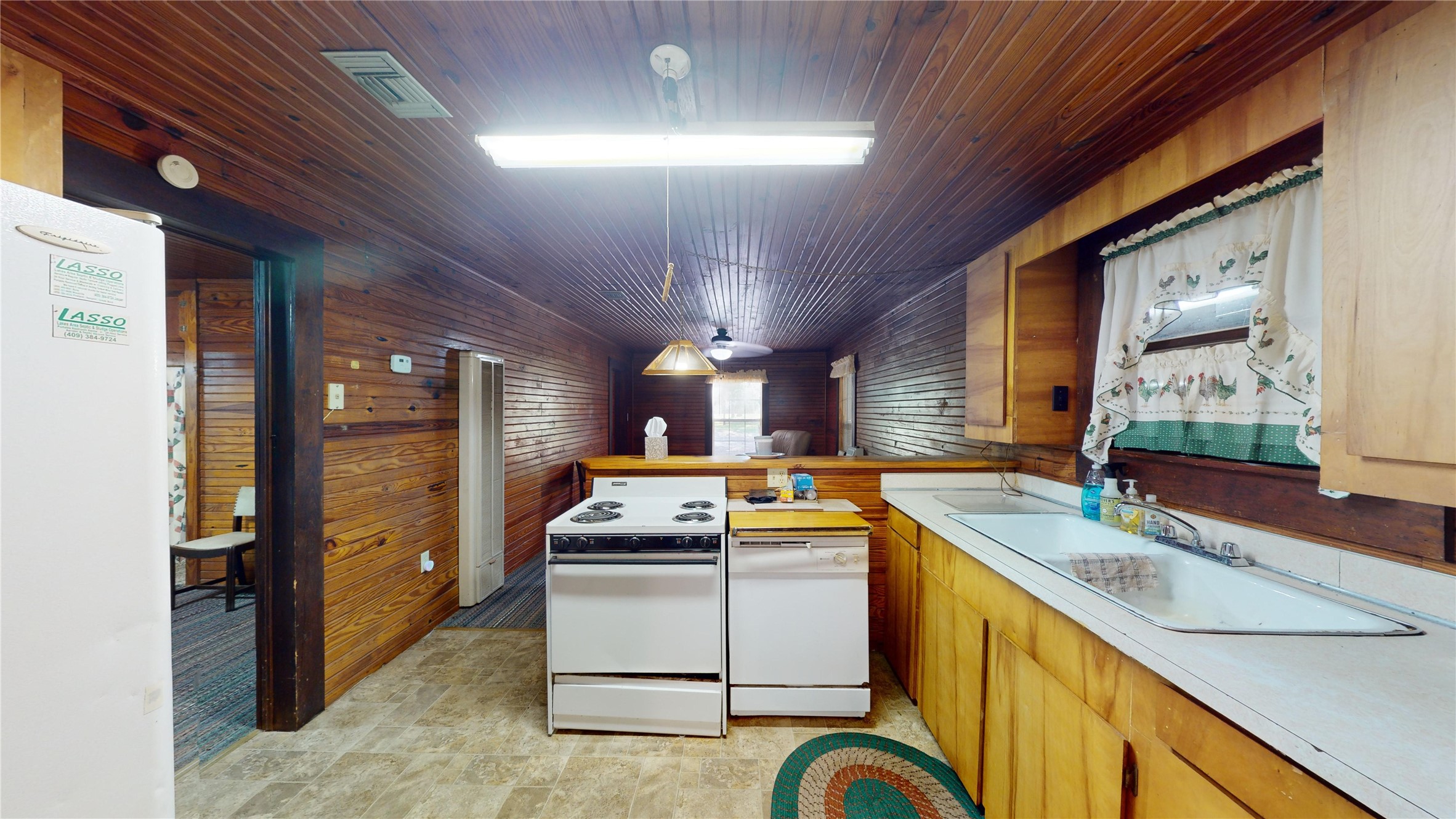 18157 State Highway 87 Call, TX 75933 - Photo 4 of 39 a kitchen that has a sink a stove and a refrigerator