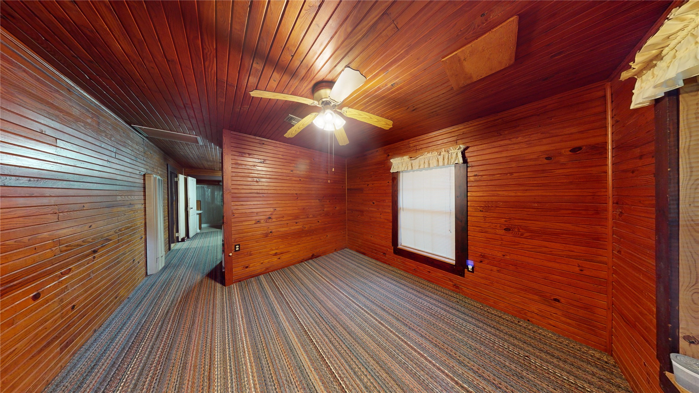 18157 State Highway 87 Call, TX 75933 - Photo 6 of 39 a view of an empty room with wooden floor and a window