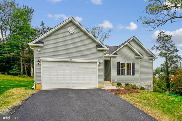 a view of balcony with wooden floor and fence