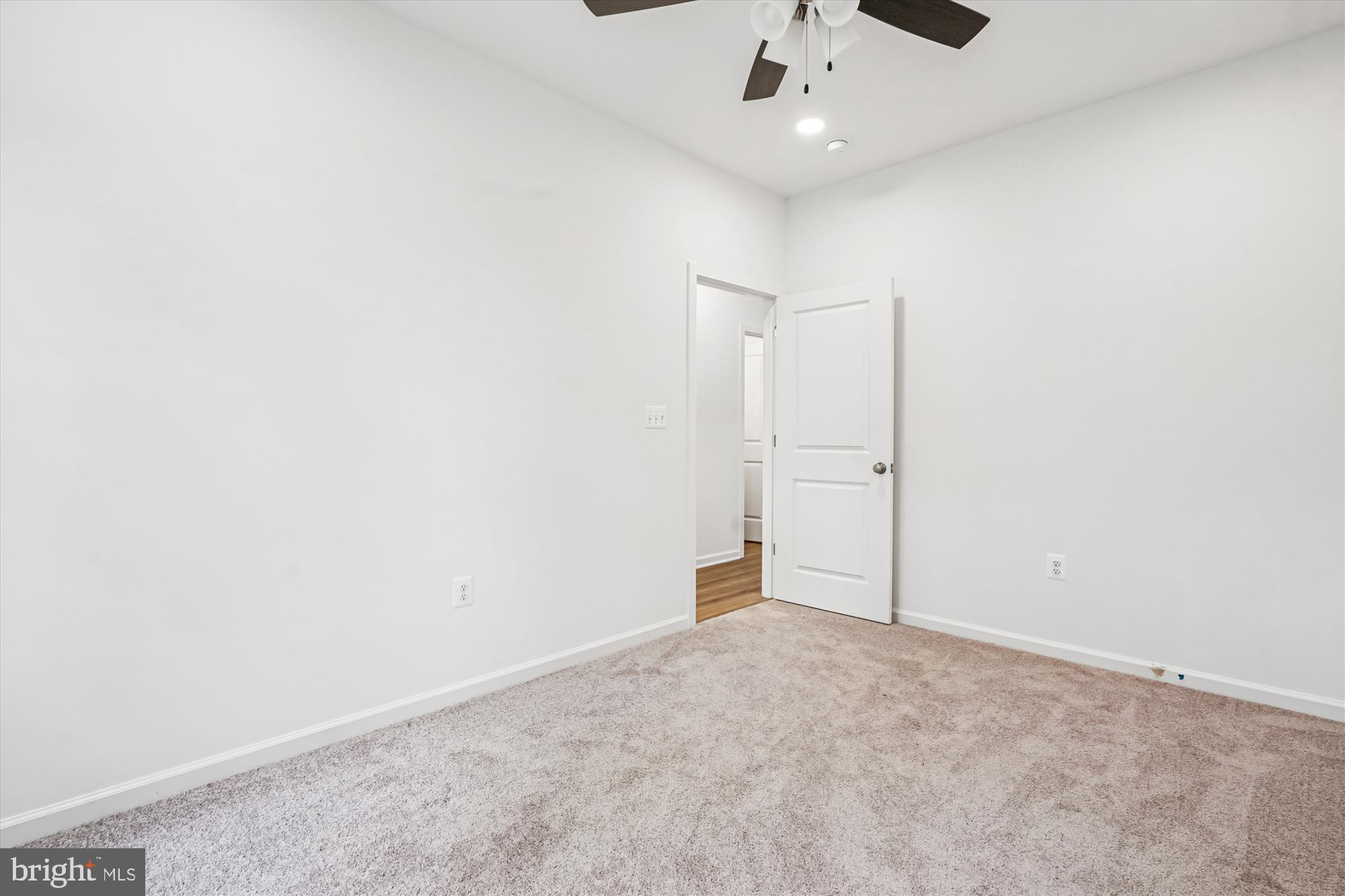 1 Eggbornsville Road Rixeyville, VA 22737 - Photo 43 of 66 an empty room with a ceiling fan and carpet