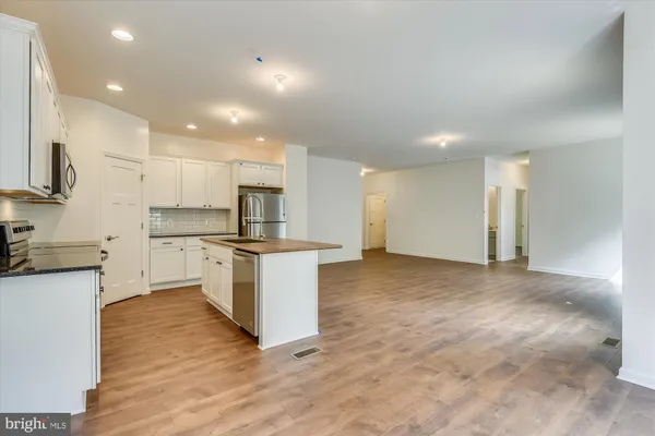 a view of kitchen with wooden floor