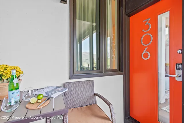 a view of a dining room with furniture and a window