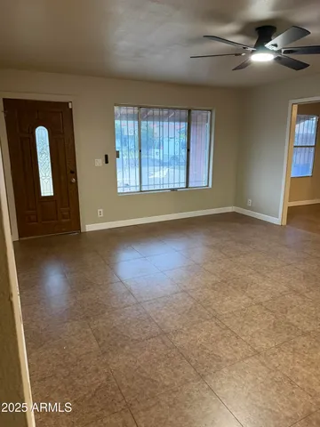 a large kitchen with cabinets and stainless steel appliances