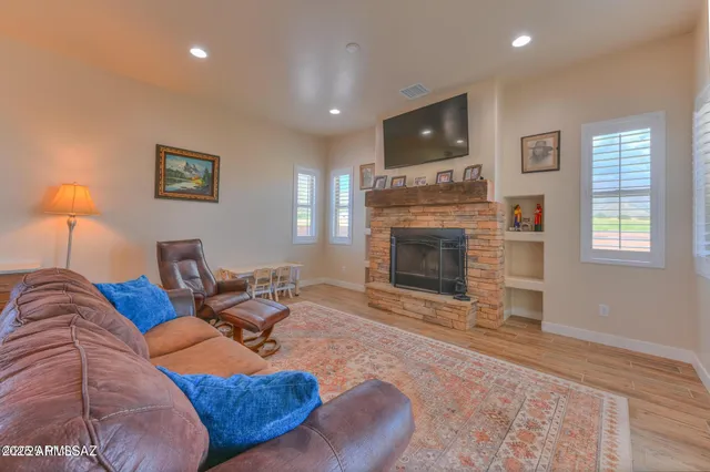 a living room with furniture and a fireplace