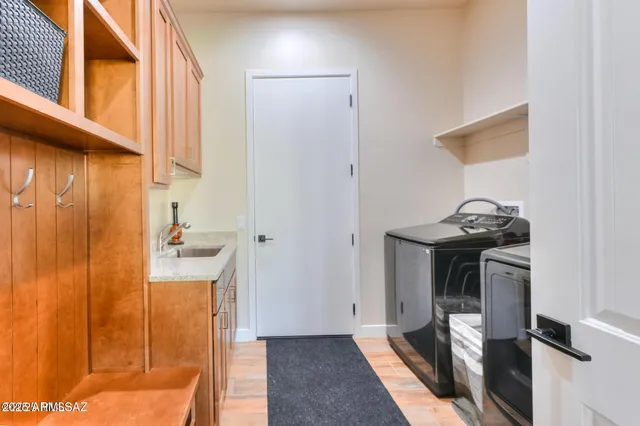 a view of a bathroom with a sink and mirror