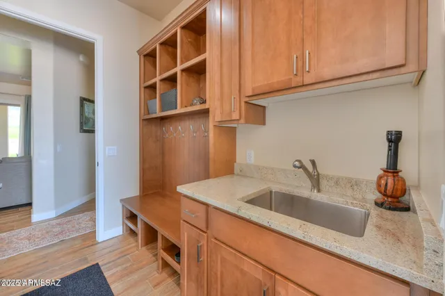 a kitchen with a sink and cabinets