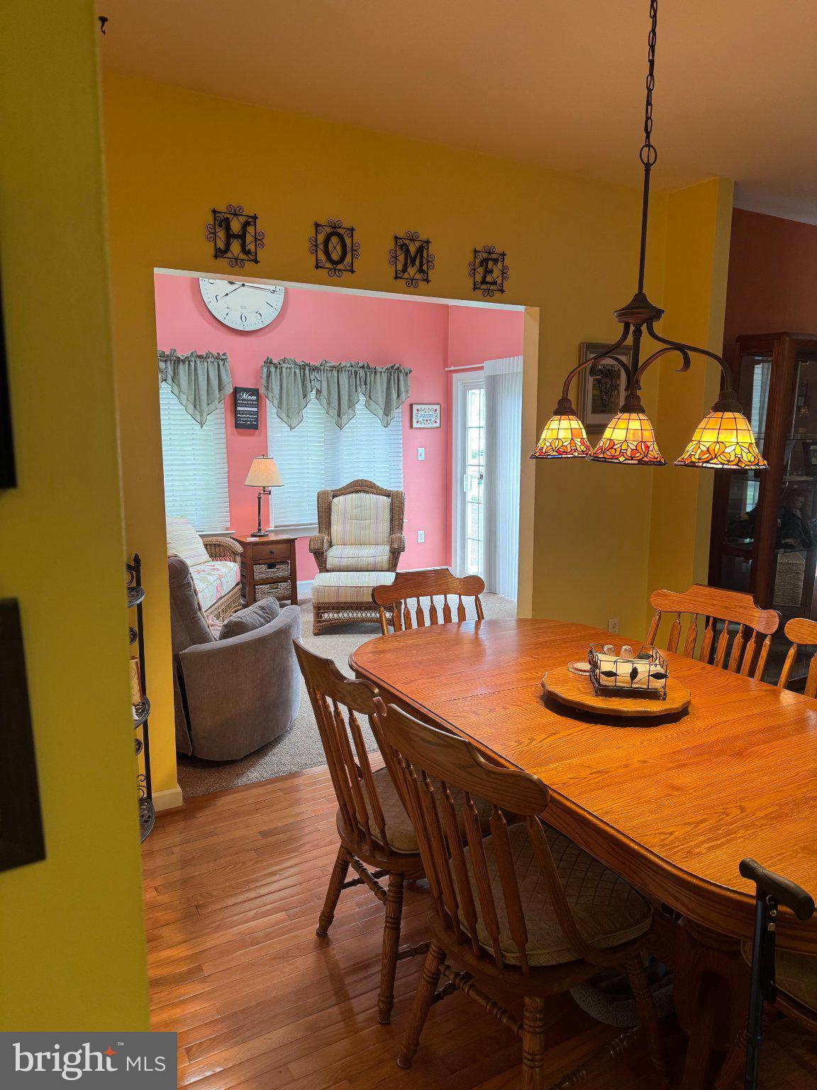 231 Foxglove Loop Bear, DE 19701 - Photo 7 of 30 a dining room with furniture and a chandelier