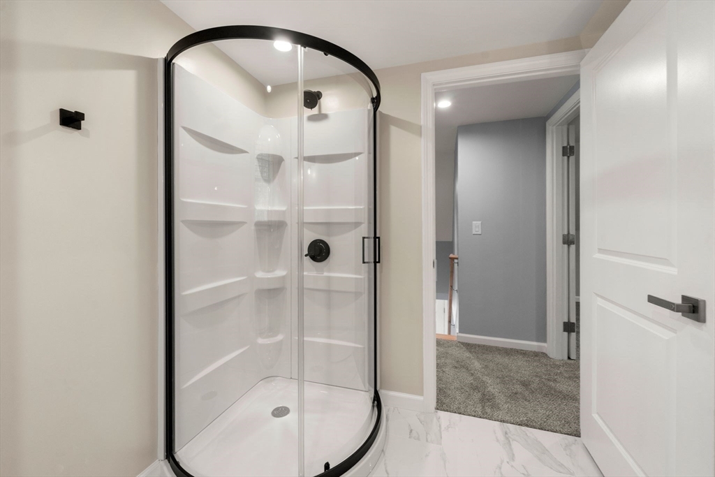 16 Churchill Road Plympton, MA 02367 - Photo 28 of 42 a bathroom with a glass shower door and a mirror