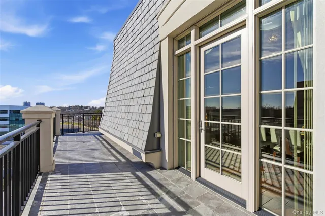 a bedroom with a bed and a television