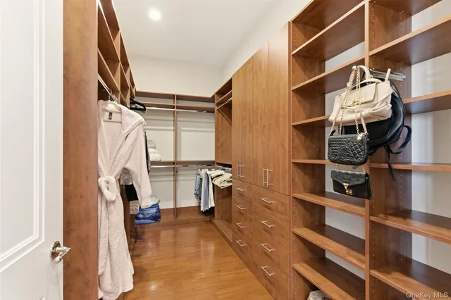 a living room with furniture a rug and a flat screen tv