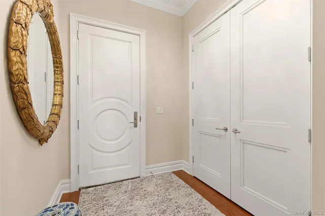 a kitchen with stainless steel appliances kitchen island granite countertop a stove a sink a refrigerator and a dining table with wooden floor