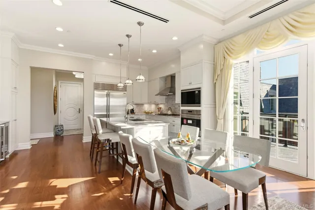 a kitchen with granite countertop a sink stainless steel appliances and cabinets