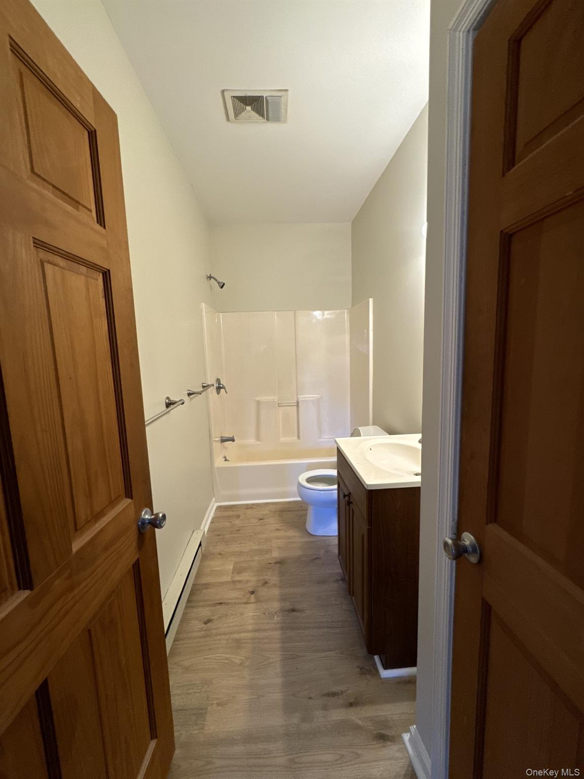 400 Round Lake Road, Unit A Rhinebeck, NY 12572 - Photo 3 of 11 a bathroom with a sink mirror vanity and toilet