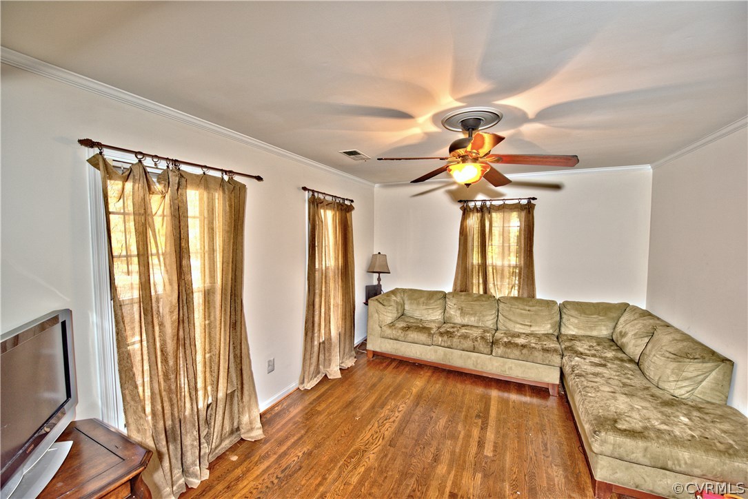 13303 Court Ridge Road Midlothian, VA 23112 - Photo 3 of 12 a spacious bedroom with a bed and a chandelier