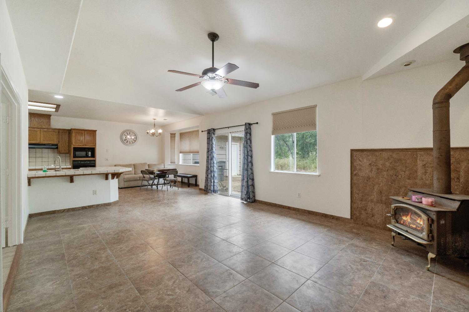 6864 Rodeo Drive Sanger, CA 93657 - Photo 12 of 48 a view of a livingroom with furniture and a kitchen