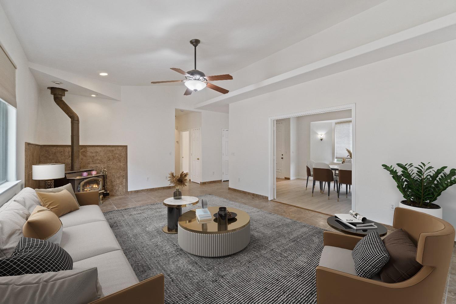 6864 Rodeo Drive Sanger, CA 93657 - Photo 13 of 48 a living room with furniture and a potted plant