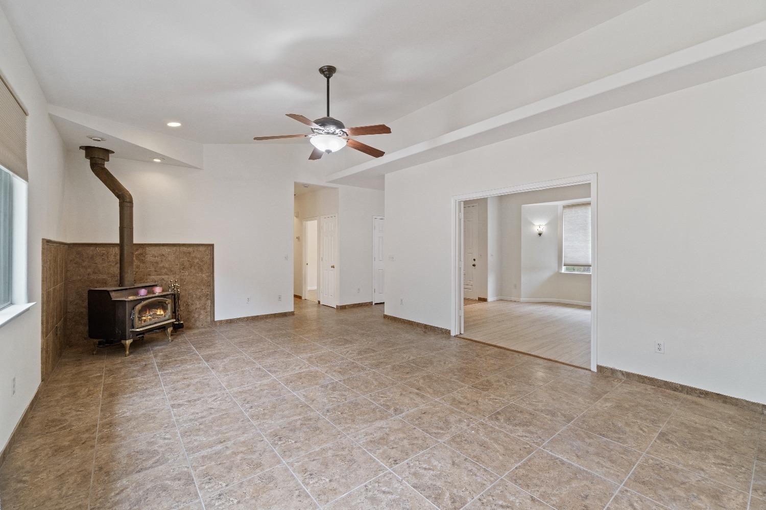 6864 Rodeo Drive Sanger, CA 93657 - Photo 14 of 48 a view of a livingroom with furniture and a ceiling fan