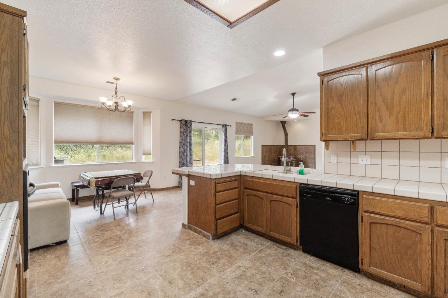 6864 Rodeo Drive Sanger, CA 93657 - Photo 19 of 48 a kitchen with lots of counter top space and dining table