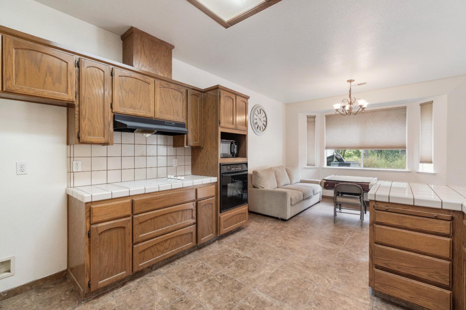 6864 Rodeo Drive Sanger, CA 93657 - Photo 20 of 48 a kitchen with cabinets a sink and appliances
