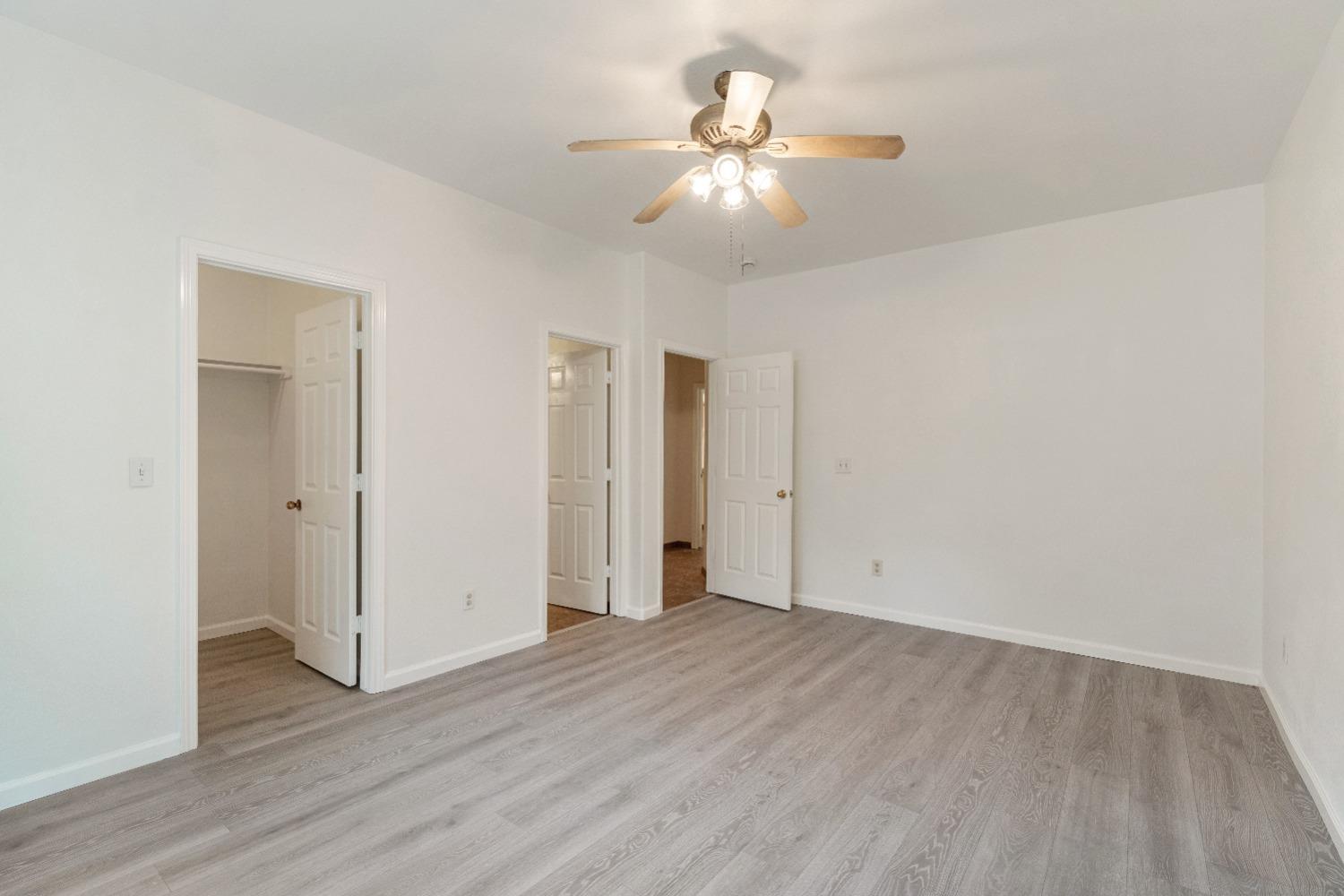 6864 Rodeo Drive Sanger, CA 93657 - Photo 33 of 48 a view of an empty room with wooden floor