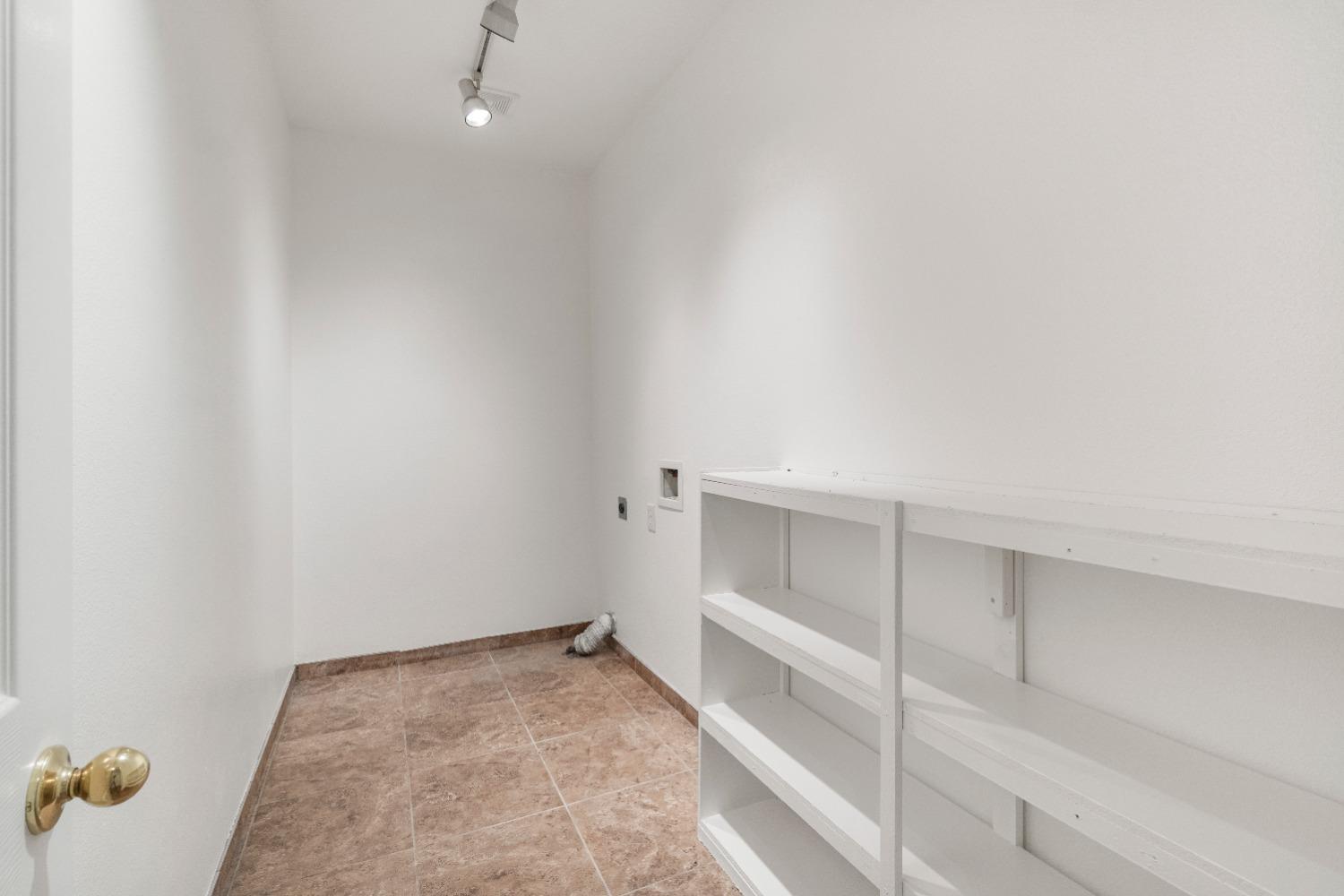 6864 Rodeo Drive Sanger, CA 93657 - Photo 34 of 48 a view of an empty walk in closet