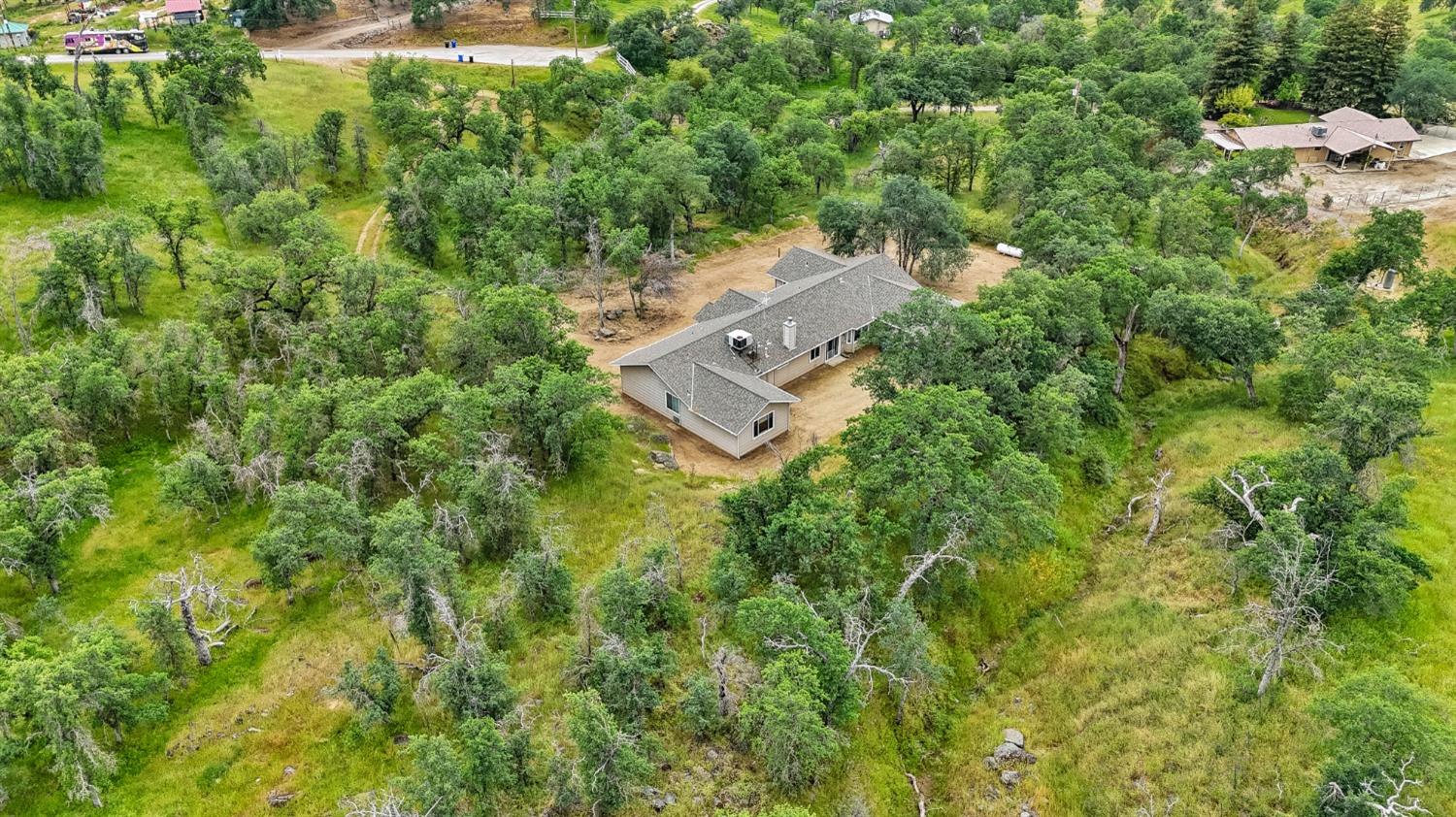 6864 Rodeo Drive Sanger, CA 93657 - Photo 44 of 48 an aerial view of a house with a yard