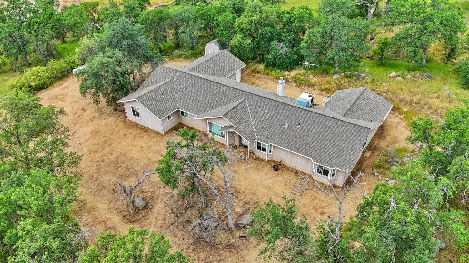 6864 Rodeo Drive Sanger, CA 93657 - Photo 6 of 48 an aerial view of a house with a yard