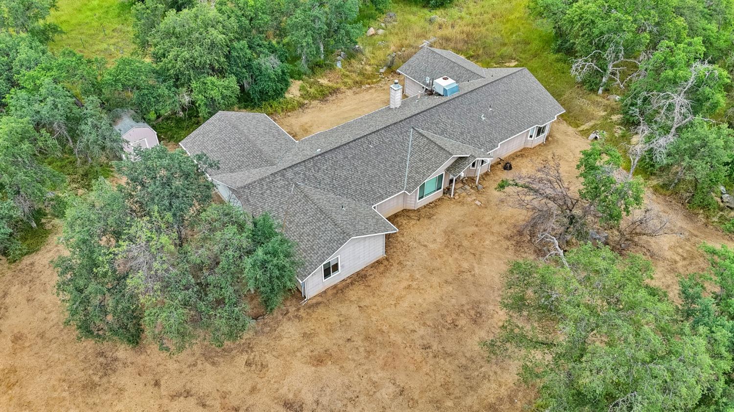 6864 Rodeo Drive Sanger, CA 93657 - Photo 7 of 48 an aerial view of a house with a yard