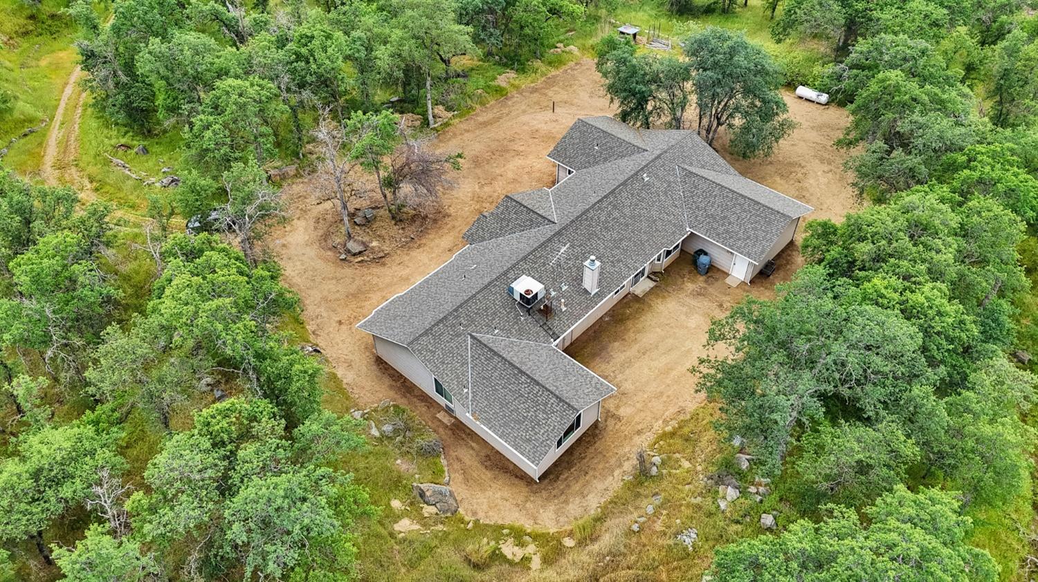 6864 Rodeo Drive Sanger, CA 93657 - Photo 8 of 48 an aerial view of a house with a yard