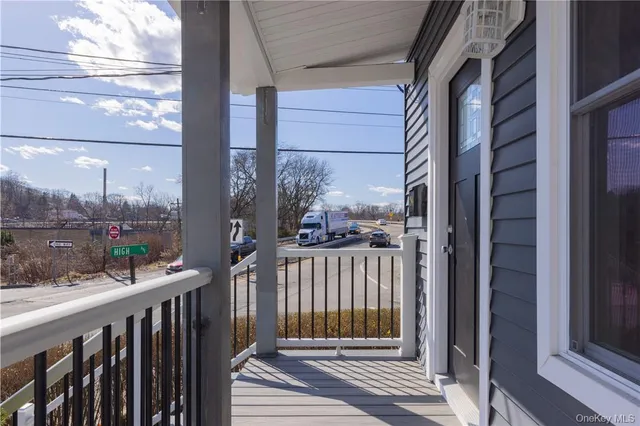a view of a balcony with a potted plant
