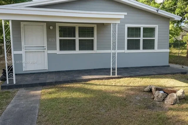 a view of a house with swimming pool