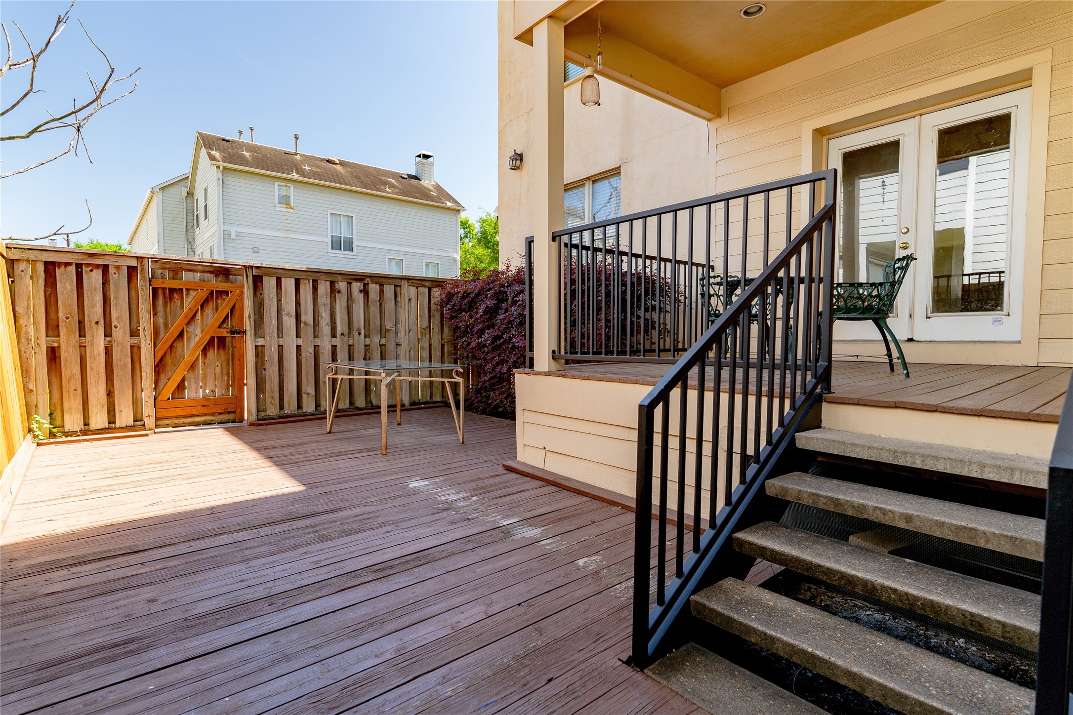 3015 Caroline Street, Unit D Houston, TX 77004 - Photo 13 of 16 a view of deck with wooden floor and fence