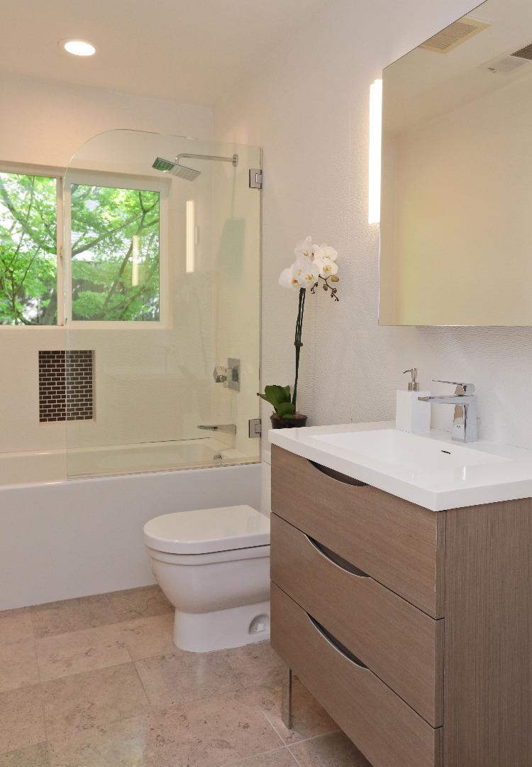 1219 Whitaker Way Menlo Park, CA 94025 - Photo 14 of 19 a bathroom with a sink toilet and large mirror
