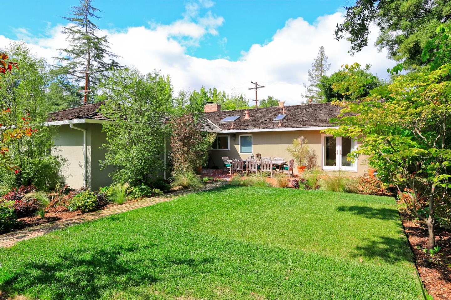 1219 Whitaker Way Menlo Park, CA 94025 - Photo 16 of 19 a front view of a house with a garden and porch