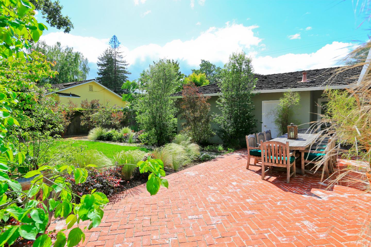 1219 Whitaker Way Menlo Park, CA 94025 - Photo 18 of 19 a view of a patio with table and chairs and potted plants