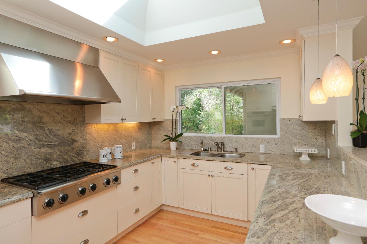 1219 Whitaker Way Menlo Park, CA 94025 - Photo 5 of 19 a kitchen with a sink stove and cabinets