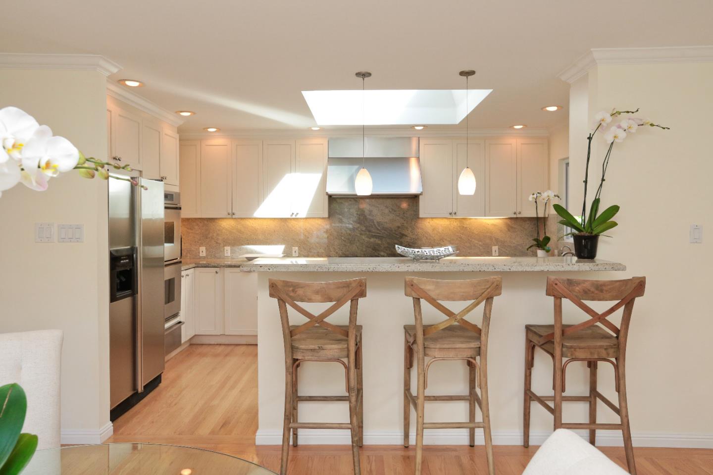 1219 Whitaker Way Menlo Park, CA 94025 - Photo 6 of 19 a kitchen with a table and chairs
