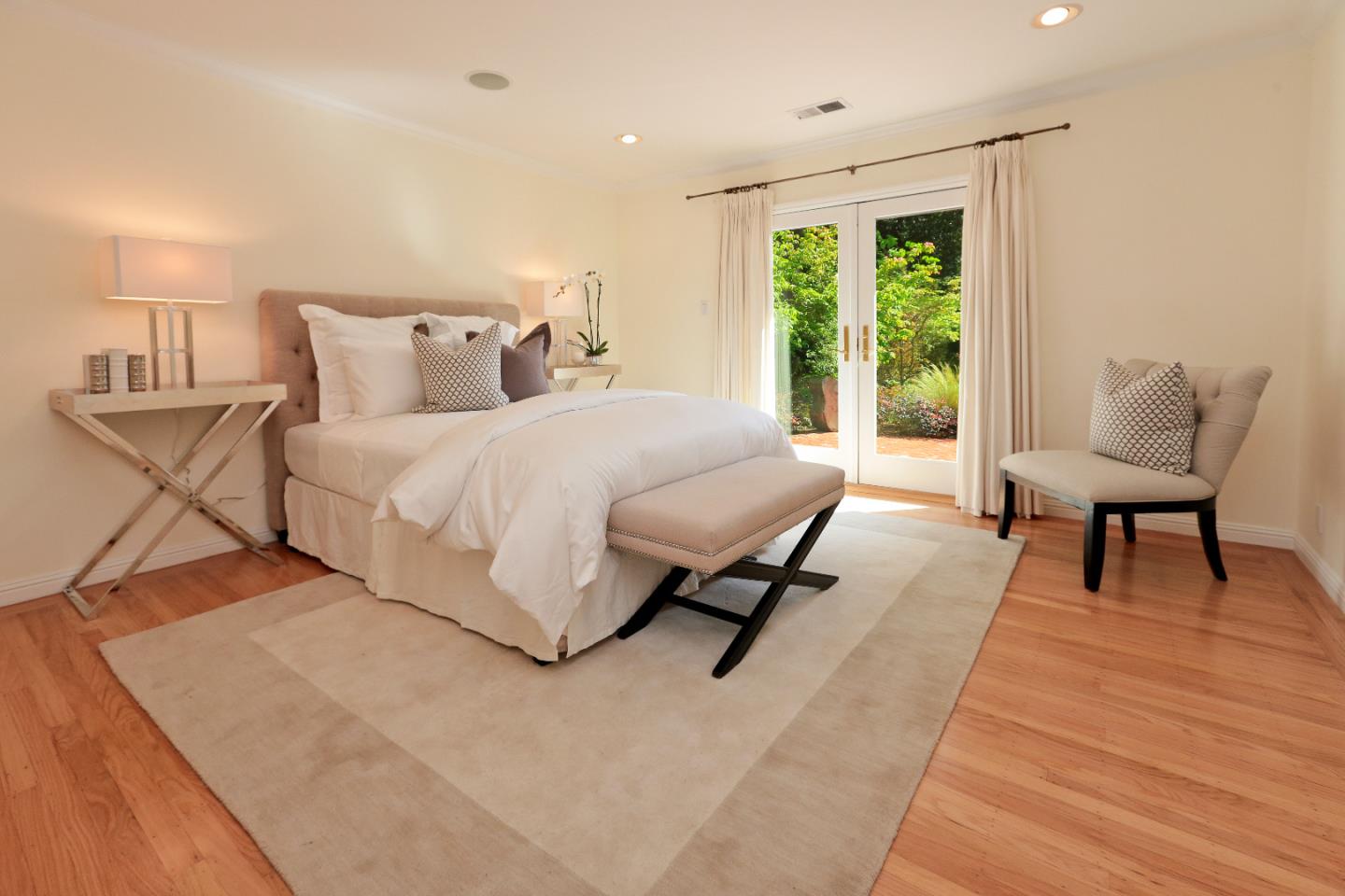 1219 Whitaker Way Menlo Park, CA 94025 - Photo 10 of 19 a spacious bedroom with a bed a chair and a large window