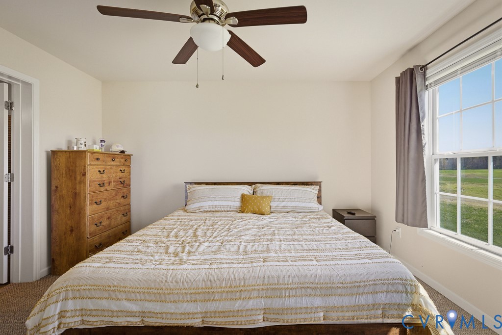 18262 Seals Road Bowling Green, VA 22427 - Photo 25 of 50 a bedroom with a bed and a window
