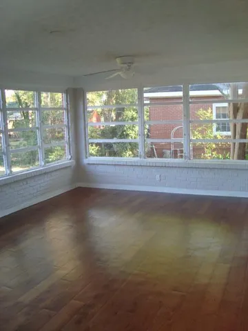 a view of a room that has a large window