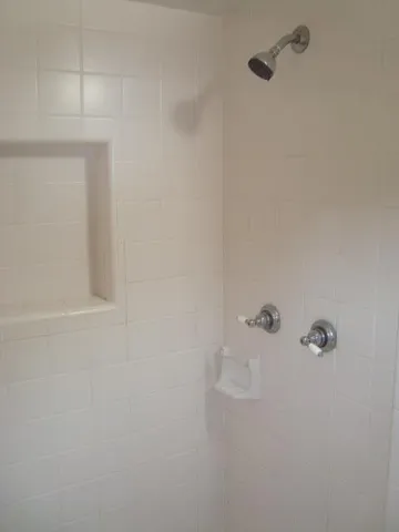 a close view of a shower in the bathroom