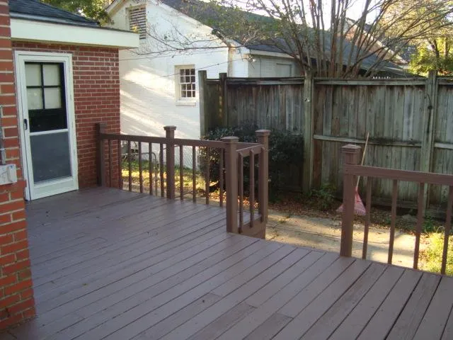 a view of a balcony with wooden floor
