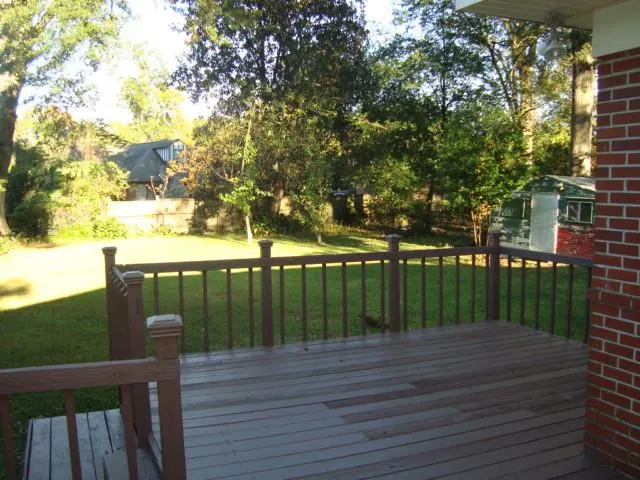 a view of deck with a lake view