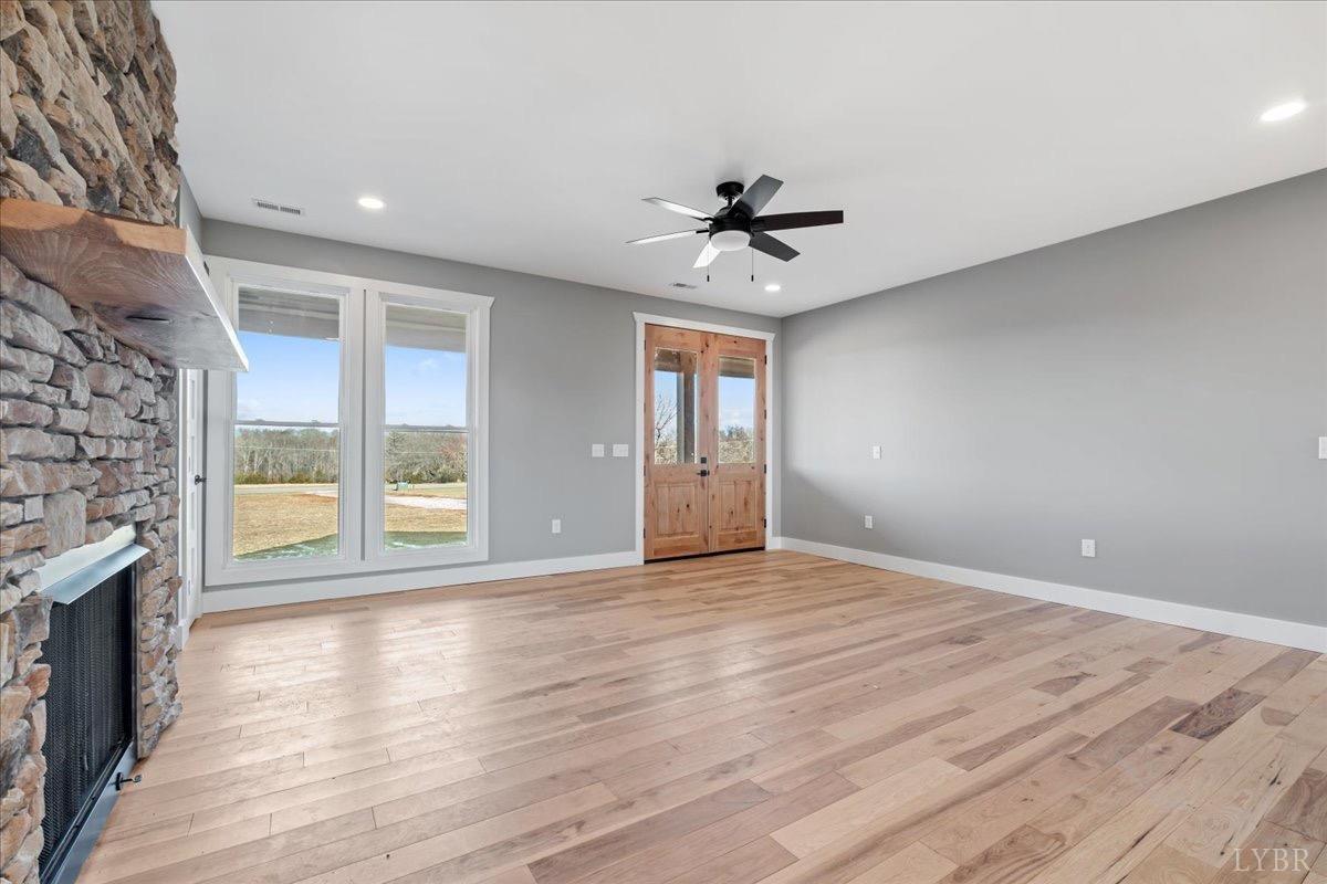 4615 Everett Road Forest, VA 24551 - Photo 11 of 56 a view of an empty room with a window and wooden floor