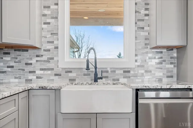 a stove top oven sitting inside of a kitchen
