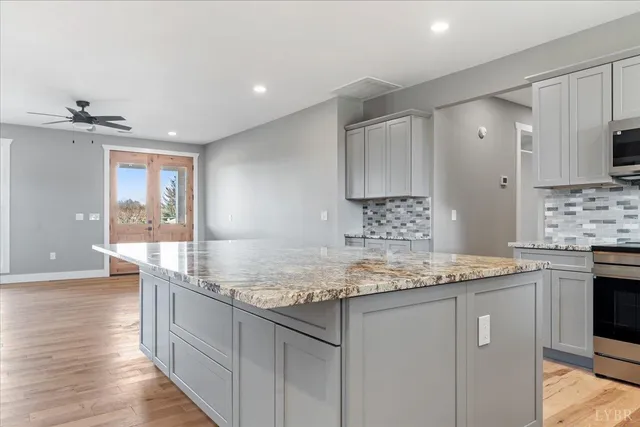 a view of a kitchen with furniture and a fireplace