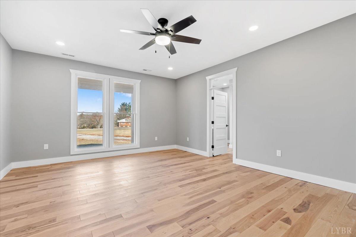 4615 Everett Road Forest, VA 24551 - Photo 26 of 56 a view of an empty room with a window and wooden floor
