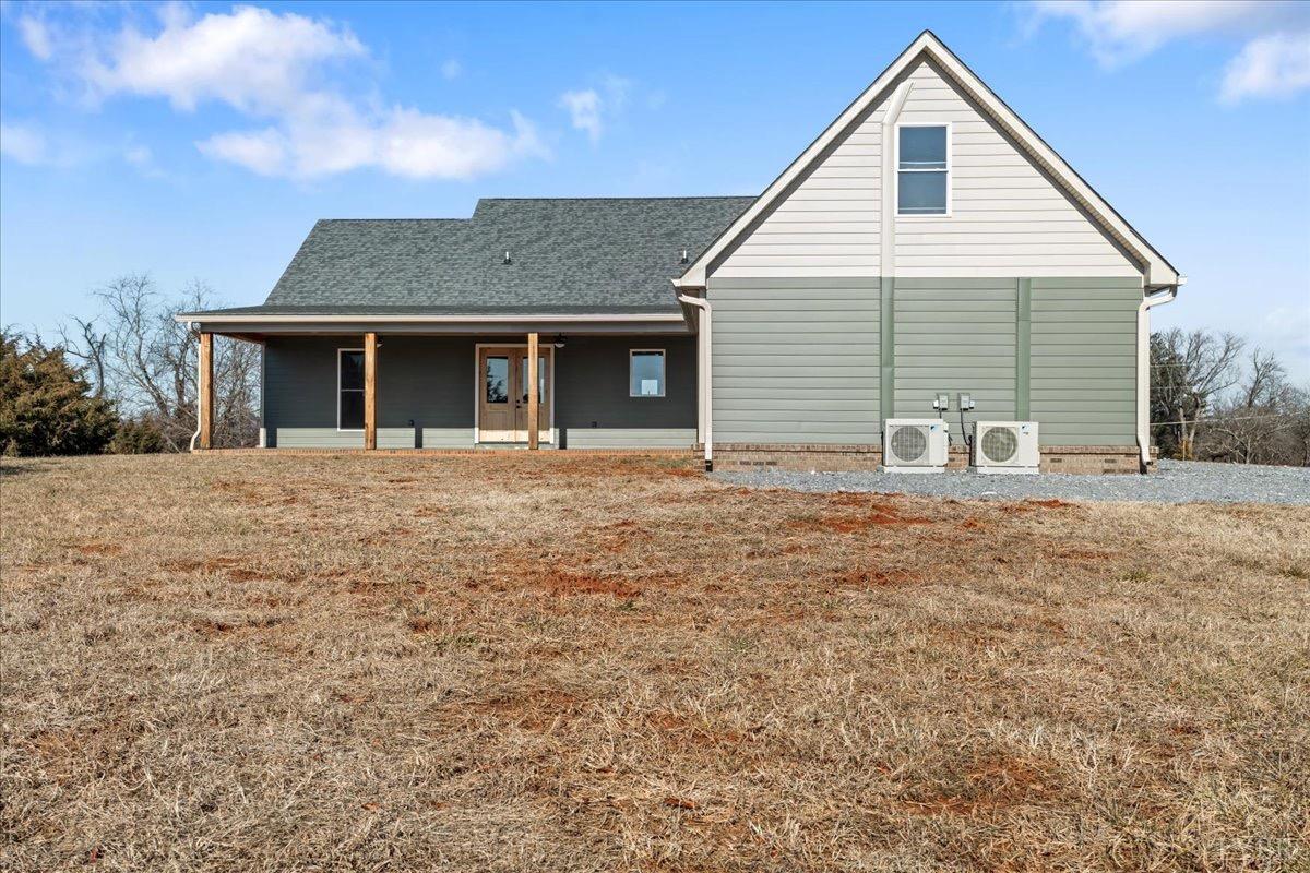 4615 Everett Road Forest, VA 24551 - Photo 45 of 56 a front view of house with yard and trees in the background