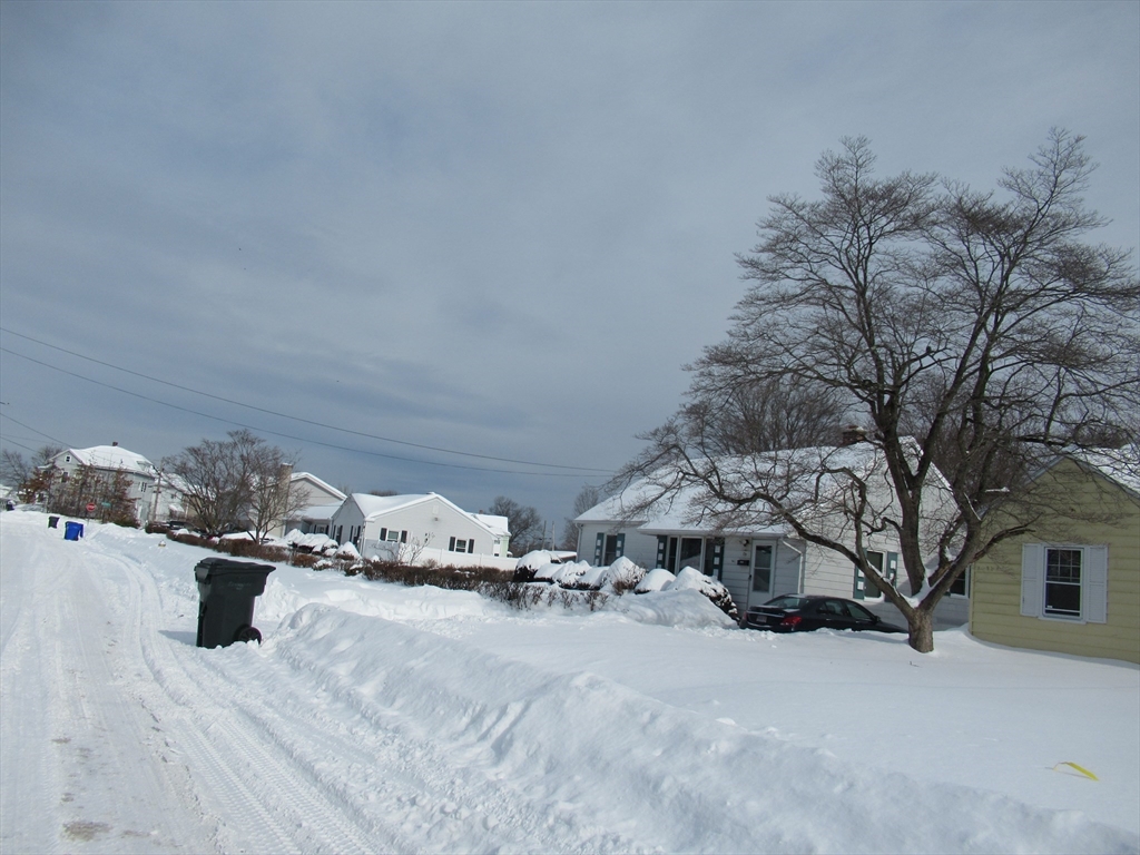 33 Connolly Street Springfield, MA 01151 - Photo 9 of 15 a view of a house with a snow in the yard