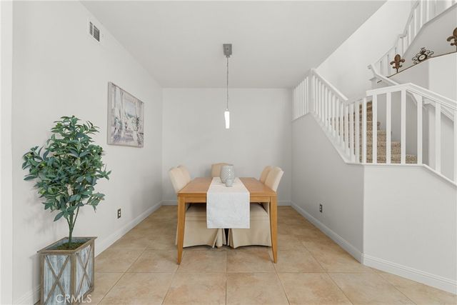 a view of a livingroom with furniture and stairs